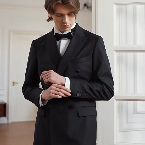 Video showcasing a Men's Sartorial double-breasted suit in Vitale Barberis Canonico twill wool. Designed with a half-canvas build, sculpted shoulders, and tapered pleated trousers. — From Borcelleclothes.