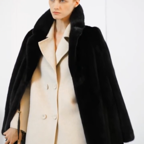 Video showcasing a Women's full-length straight-cut mink fur coat in Rich Black with high collar, notch lapels, and invisible closure — worn with confidence and restraint. From Borcelleclothes.