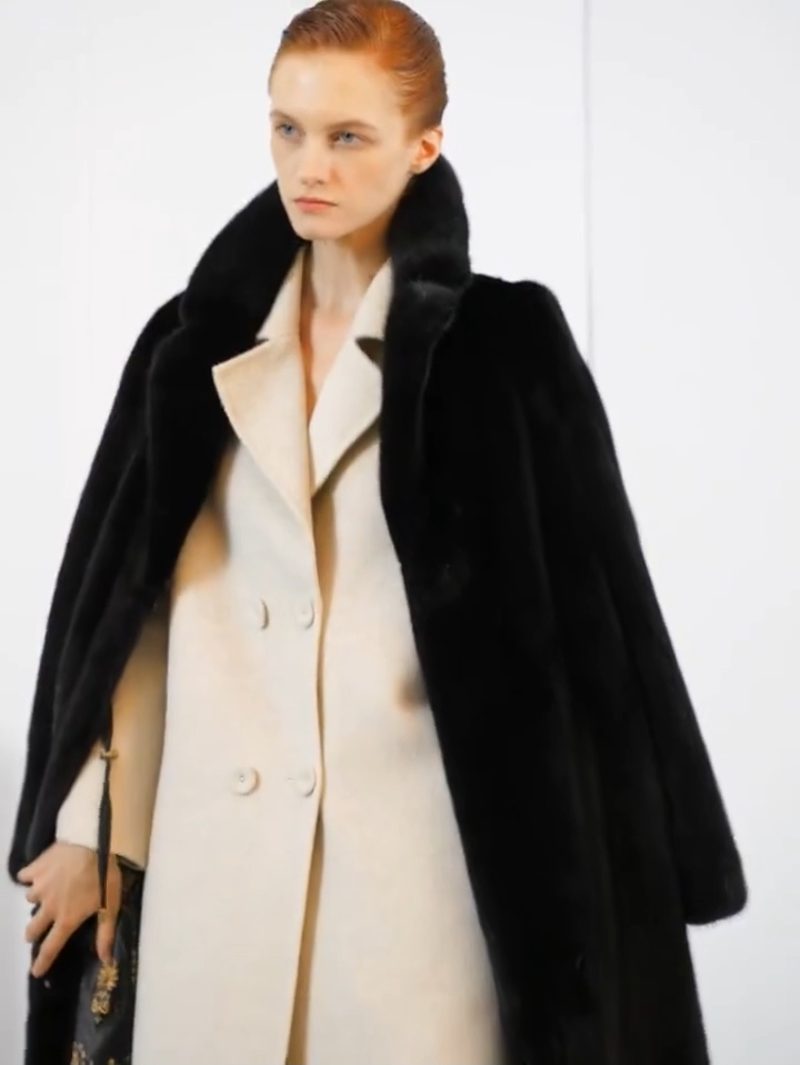 Video showcasing a Women's full-length straight-cut mink fur coat in Rich Black with high collar, notch lapels, and invisible closure — worn with confidence and restraint. From Borcelleclothes.
