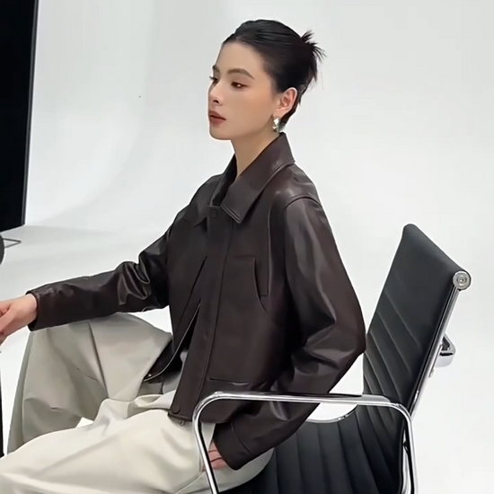 Video showcasing a Women's Vegetable-tanned full-grain sheepskin jacket in Rich Juniper, with an uncoated, natural finish. Features a boxy cropped silhouette, sharp collar, and overlaid details. — From Borcelleclothes.