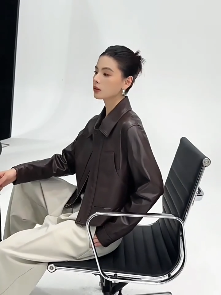 Video showcasing a Women's Vegetable-tanned full-grain sheepskin jacket in Rich Juniper, with an uncoated, natural finish. Features a boxy cropped silhouette, sharp collar, and overlaid details. — From Borcelleclothes.