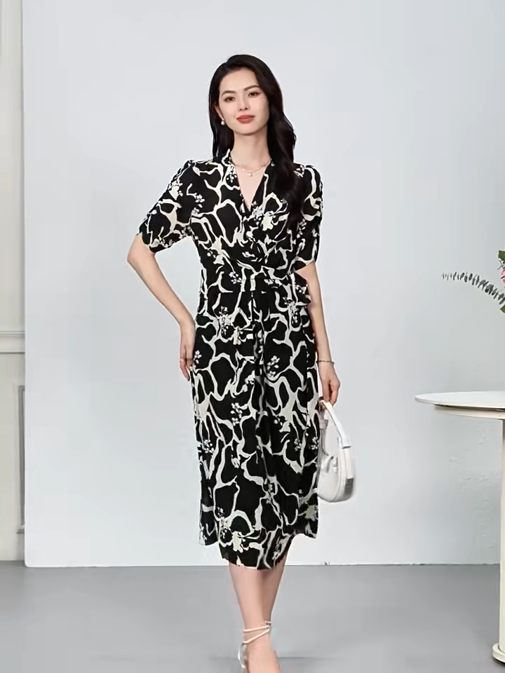 Video showcasing a Women's midi-length wrap silk dress in Rorschach Inkblot Test color features a wrap V-neckline, 1/3 sleeves with gathered cuffs, and front box pleats on the skirt. — From Borcelleclothes.