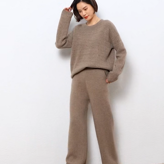 Video Showcasing a Women's Straight Cut Alashan cashmere trousers in Sandrift, featuring a straight cut, front slash pockets, and a ribbed waistband — From Borcelleclothes.