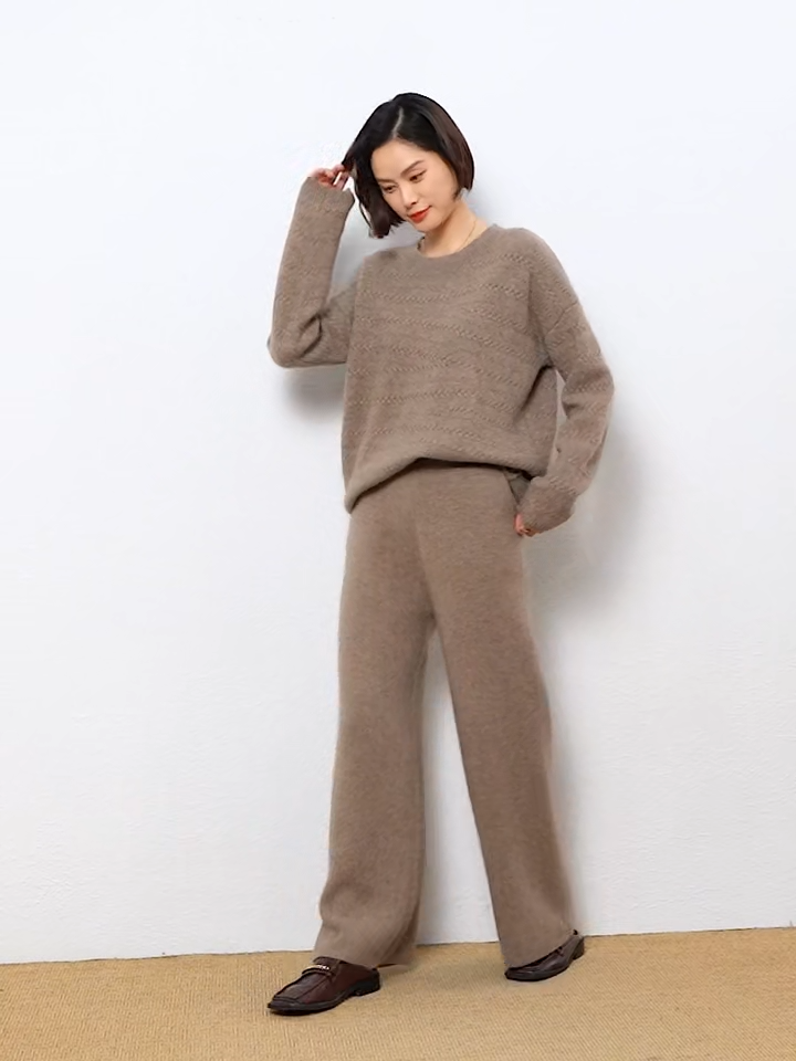 Video Showcasing a Women's Straight Cut Alashan cashmere trousers in Sandrift, featuring a straight cut, front slash pockets, and a ribbed waistband — From Borcelleclothes.