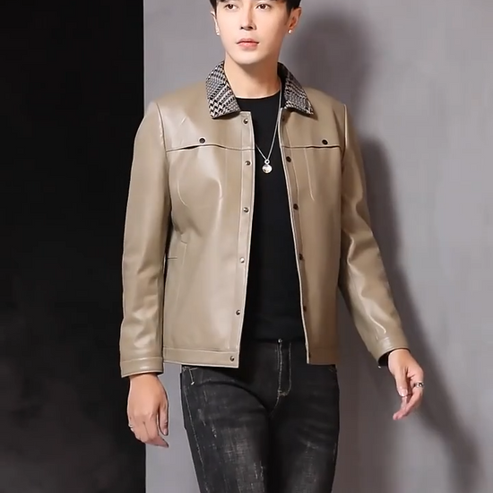 Video showcasing a Men's Woven-collar sheepskin jacket in Shadow; double-placket snap front; snap-entry chest pockets; single-welt waist pockets; banded hem; snap cuffs — From Borcelleclothes.