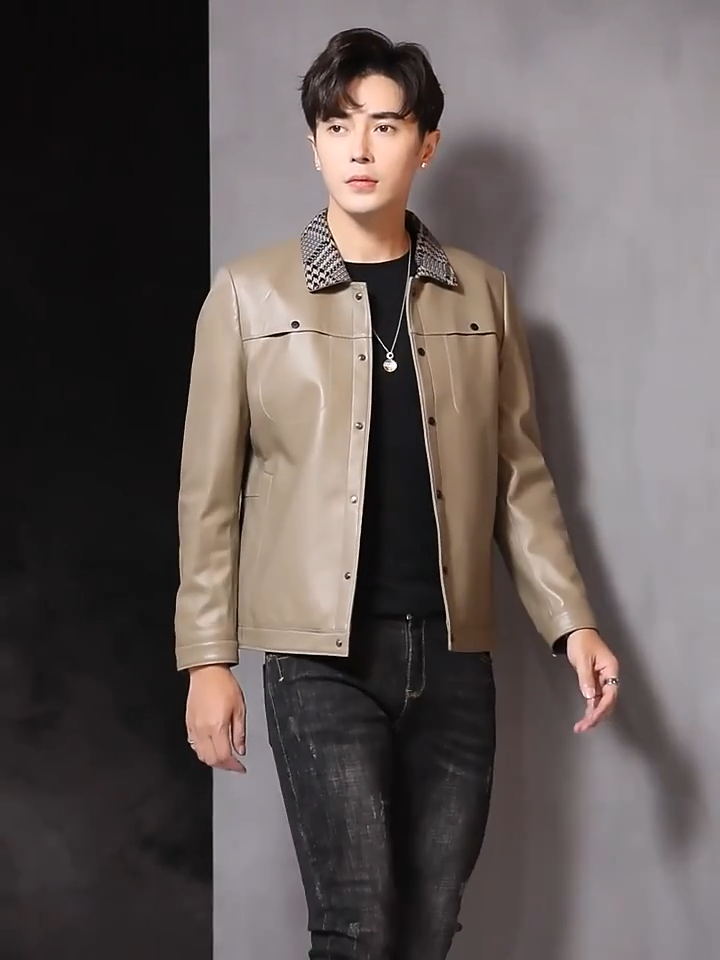 Video showcasing a Men's Woven-collar sheepskin jacket in Shadow; double-placket snap front; snap-entry chest pockets; single-welt waist pockets; banded hem; snap cuffs — From Borcelleclothes.