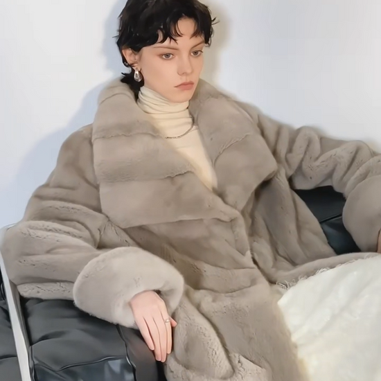 Video showcasing a Women's Mid-calf coat in Smokey Quarts, crafted from premium Kopenhagen sheared mink fur, featuring a flared silhouette, wide lapels, drawstring waist, and turn-back cuffs — From Borcelleclothes.
