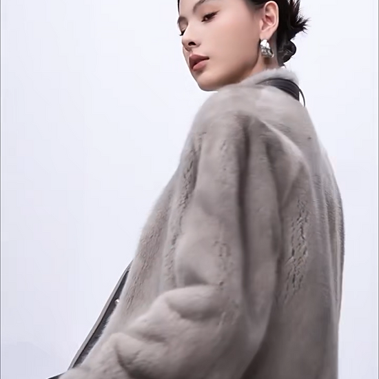 Women's mink fur jacket in Smokey Quartz and Topaz, with a leather neck belt and contrast shearling panels. Feminine structure, unyielding form. — From Borcelleclothes.