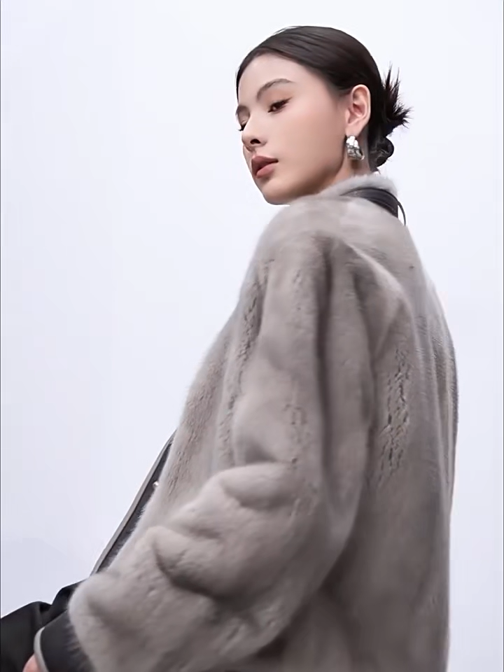 Women's mink fur jacket in Smokey Quartz and Topaz, with a leather neck belt and contrast shearling panels. Feminine structure, unyielding form. — From Borcelleclothes.