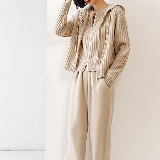 Video showcasing a Women's Cashmere Pleated Trousers in Soft Amber, with four front pleats and a structured waistband — From Borcelleclothes.