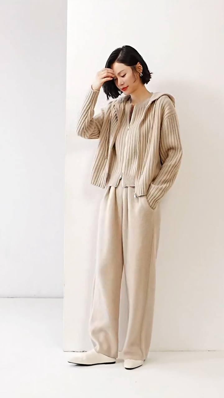 Video showcasing a Women's Cashmere Pleated Trousers in Soft Amber, with four front pleats and a structured waistband — From Borcelleclothes.