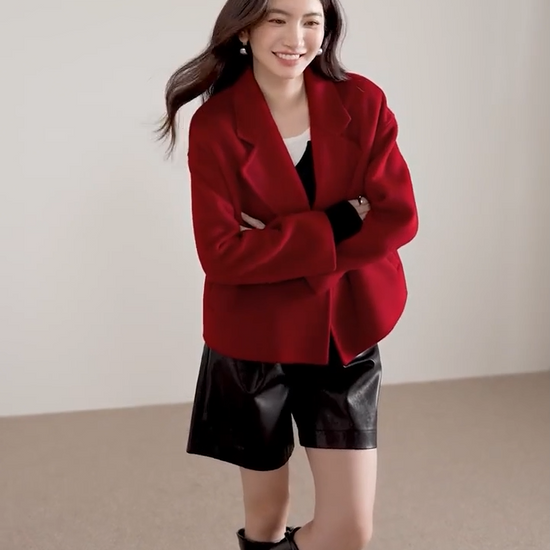 Video showcasing a Women's cropped double-breasted 100% virgin wool jacket in Sweet Rebellion shade, featuring notch lapels and hand-finished double-faced construction. — From Borcelleclothes.