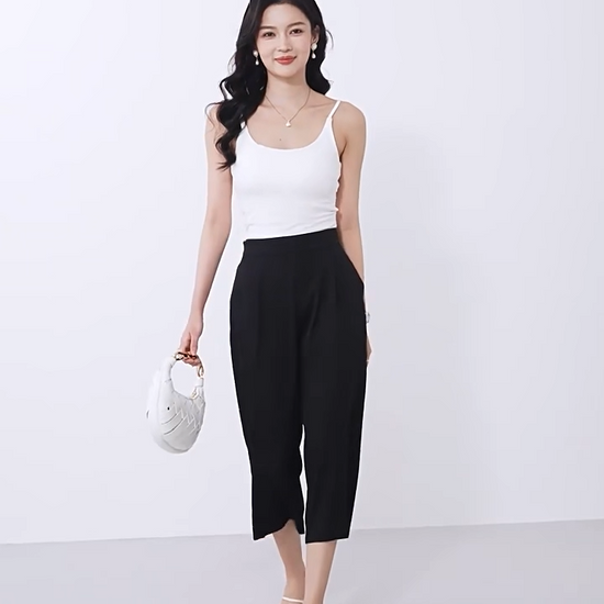 Video showcasing a Women's wide-leg Mulberry silk trousers in Tactile Setting with front pleats, elasticated waistband & pockets. — From Borcelleclothes.
