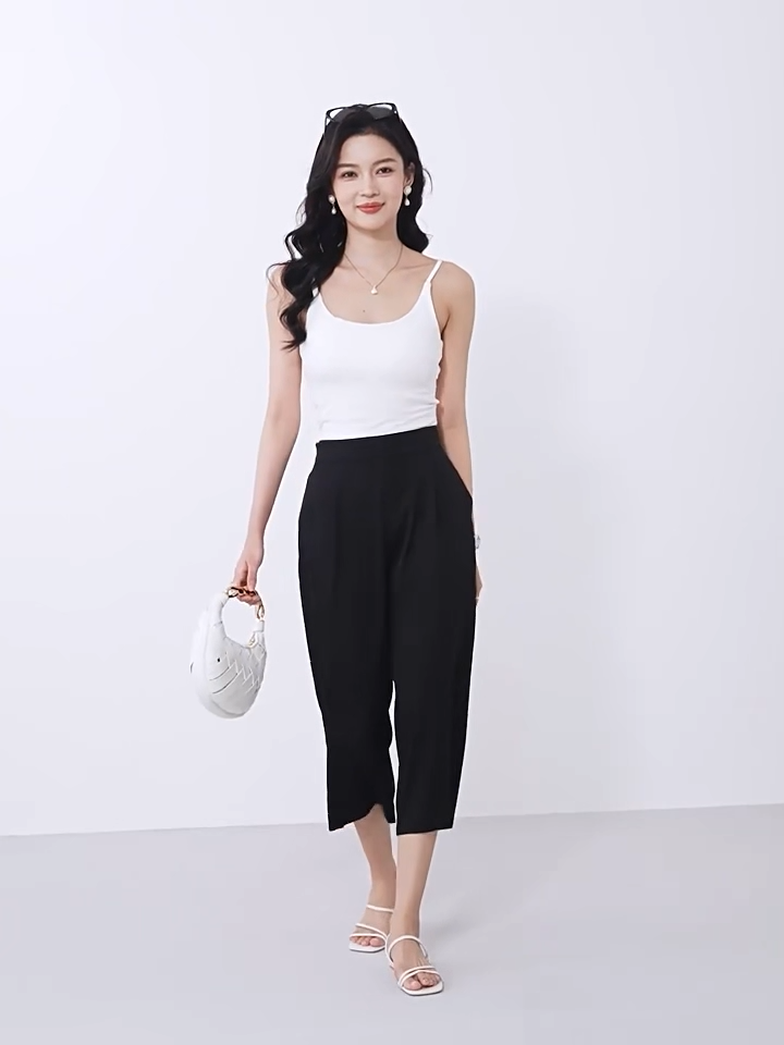 Video showcasing a Women's wide-leg Mulberry silk trousers in Tactile Setting with front pleats, elasticated waistband & pockets. — From Borcelleclothes.