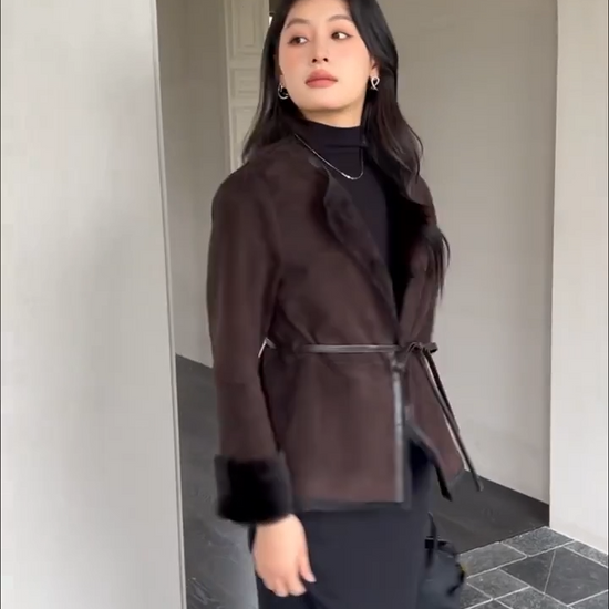 Video showcasing a Women’s slim-fit goatskin jacket in Tamarind with round neckline, leather-bound edges, and full inner wool — From Borcelleclothes.