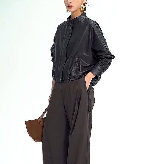 Video showcasing a Women's Cropped artisan vegetable-tanned sheepskin jacket in Ti Guardo Adesso. Featuring a band collar, draped kimono sleeves, and side drawstrings. — From Borcelleclothes.