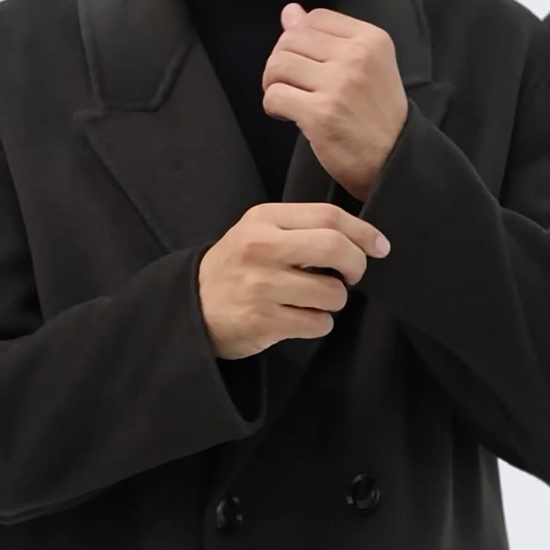 Video showcasing a Men’s double-breasted wool coat with peaked lapels in Tautara—crafted for silence, weight, and enduring presence. From Borcelleclothes.