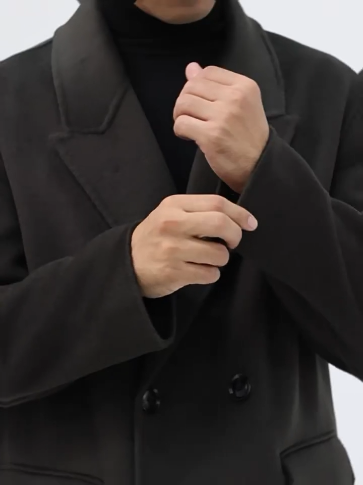 Video showcasing a Men’s double-breasted wool coat with peaked lapels in Tautara—crafted for silence, weight, and enduring presence. From Borcelleclothes.