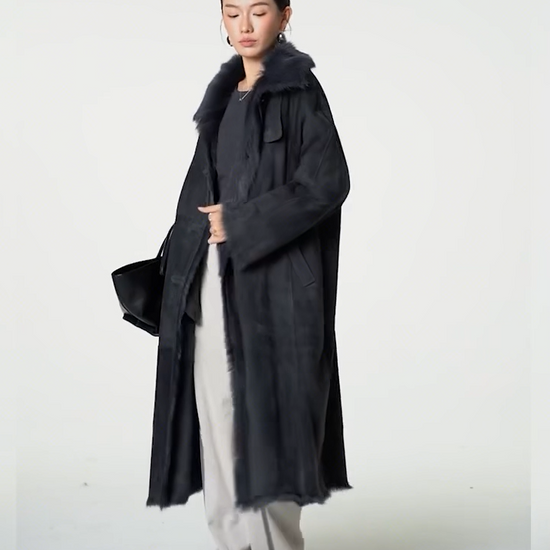 Video showcasing a Women's Convertible collar goatskin coat in Tusch color with a straight silhouette, leather-bound buttonholes, and visible interior fur accents — From Borcelleclothes.
