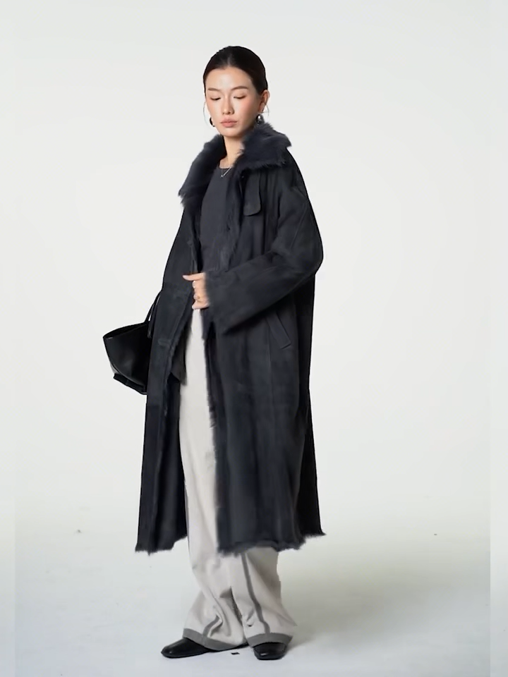 Video showcasing a Women's Convertible collar goatskin coat in Tusch color with a straight silhouette, leather-bound buttonholes, and visible interior fur accents — From Borcelleclothes.