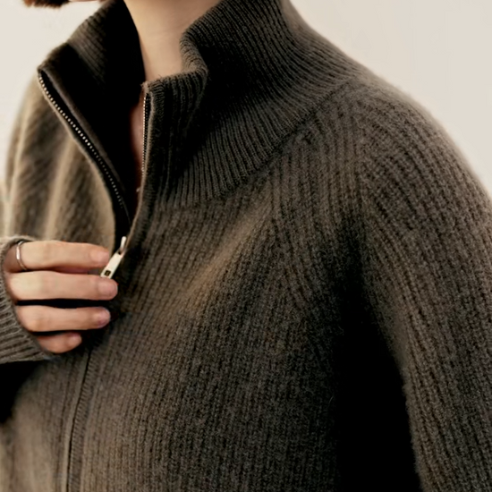 Video showcasing a Women’s English rib cashmere cardigan in Vanilla and Umber, with zip front and raglan sleeves — From Borcelleclothes.