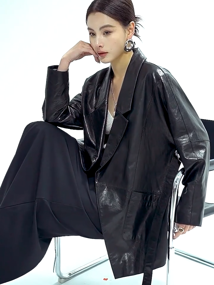 Video showcasing a Women's Glazed goatskin nappa wrap jacket in Vola Con Me. Tailored with low-notch lapels, tapering kimono sleeves, and the fluid drape of heavy silk. — From Borcelleclothes.