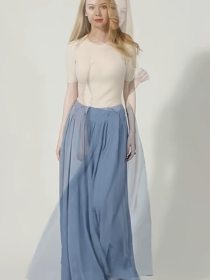 Video showcasing a Women's heavyweight 6A Grade Mulberry Silk skirt in Wandering River, featuring a sculptural arched inset panel construction and an innovative, geometric tiered facing. — From Borcelleclothes.