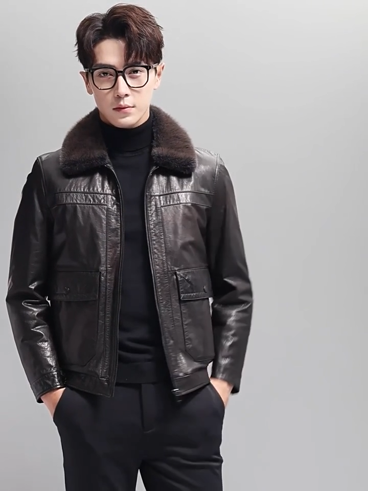 Video showcasing a Men’s leather down jacket in Wenge color with mink fur collar, stitched yokes, and side patch pockets with hidden zip entries — From Borcelleclothes.