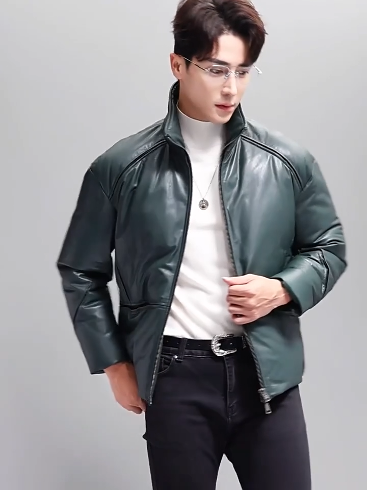 Video showcasing a Men’s sheepskin down jacket with sculpted seams revealing contrast inserts — shown in Winter Balsam. —From Borcelleclothes.