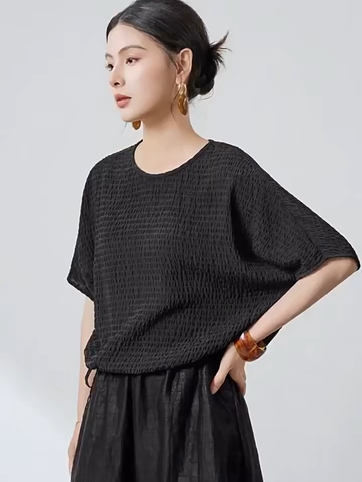Video showcasing a Women's Wrinkle-resistant Mulberry silk blouse in textured 3D stripes and Without Pressure color. Features batwing sleeves, a round neckline, and an adjustable hem. —From Borcelleclothes.