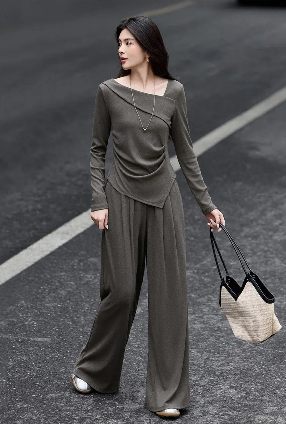 Woman in motion wearing a fluid wide-leg architectural knit set — From Borcelleclothes.