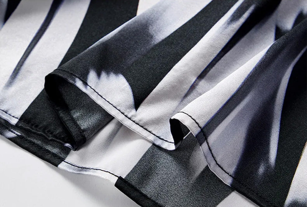 Close-up of precision stitched bottom hem on Mulberry silk satin blouse — From Borcelleclothes.