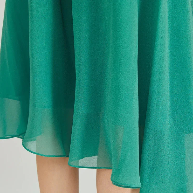 Detail view of the semi-sheer asymmetrical handkerchief hem on 12 momme silk georgette trousers — From Borcelleclothes.