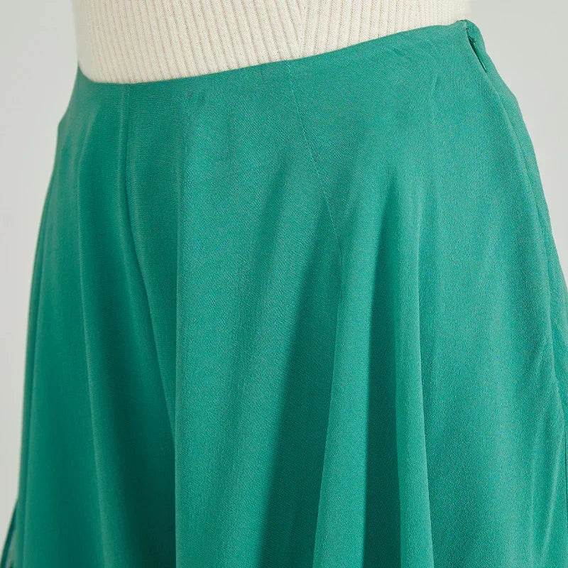 Close-up of the concealed left-side zipper closure on green Mulberry silk trousers — From Borcelleclothes.