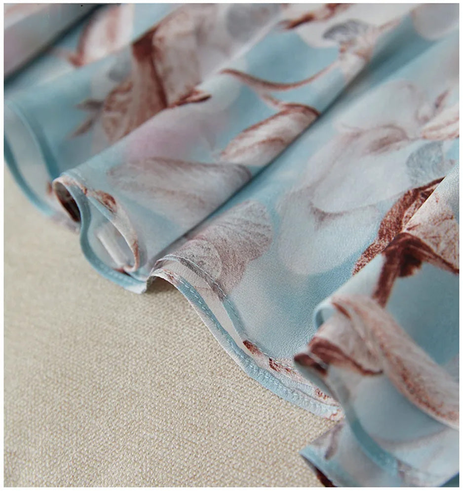 Macro shot of the clean tailoring and premium stitching on the bottom hem of the silk dress — From Borcelleclothes.