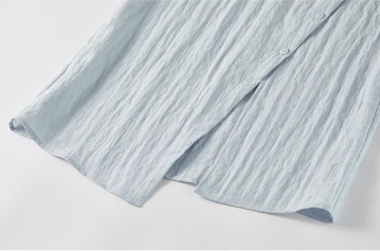 Detail shot of the bottom part of the asymmetrical top, focusing on the angled hip opening — From Borcelleclothes.