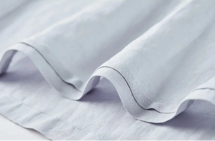 Close-up of the skirt's hem pleat, highlighting the layered aesthetic — From Borcelleclothes.