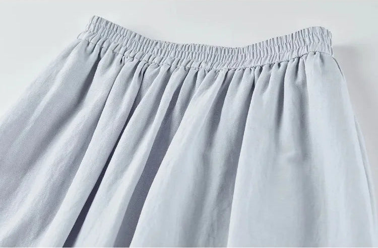 Detailed view of the skirt's elasticated waistband and fabric texture — From Borcelleclothes.