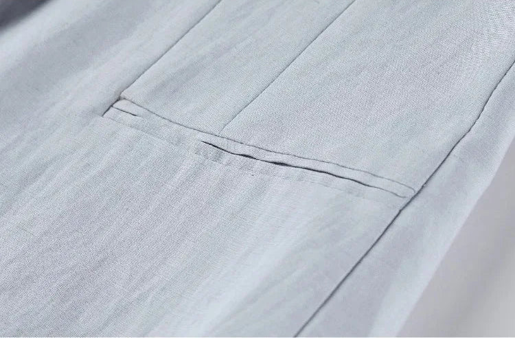 Close-up of the side double-welt pocket on the structured lavender vest — From Borcelleclothes.