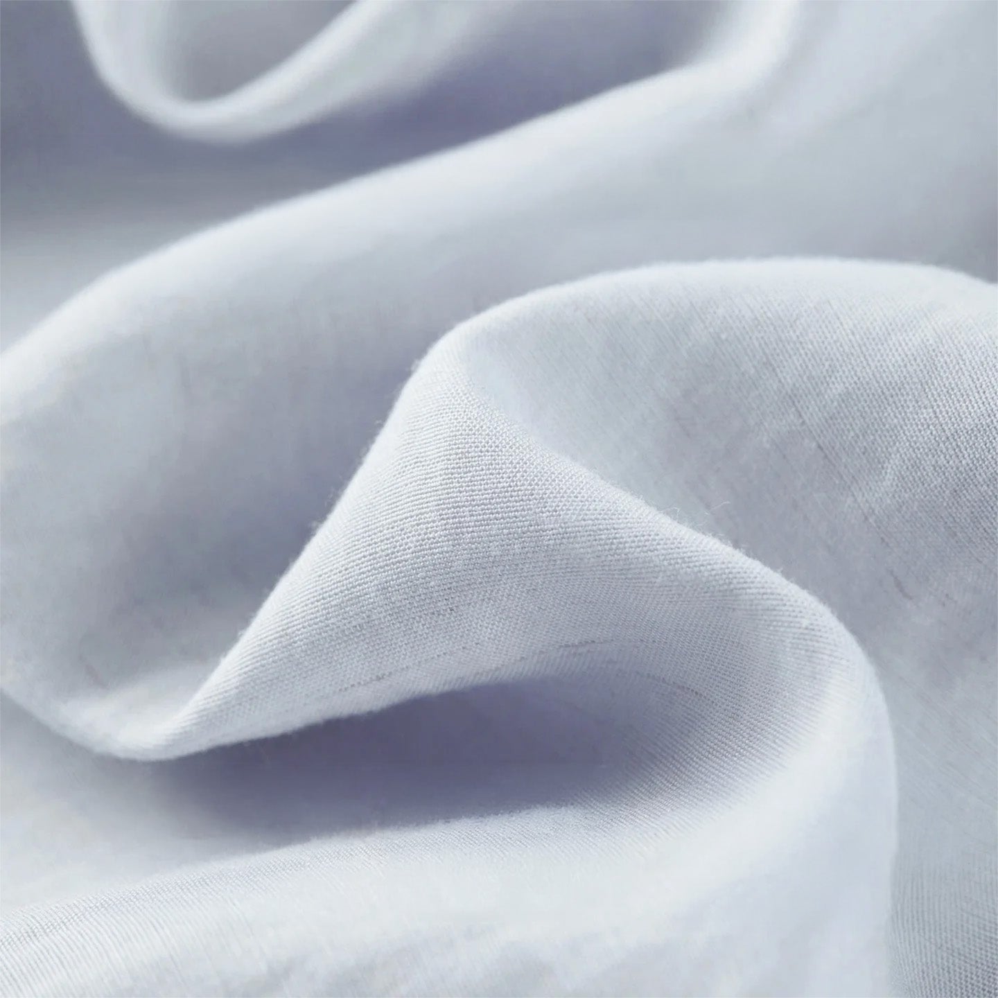 Detailed texture shot of lavender lyocell-linen fabric in soft wave folds — From Borcelleclothes.