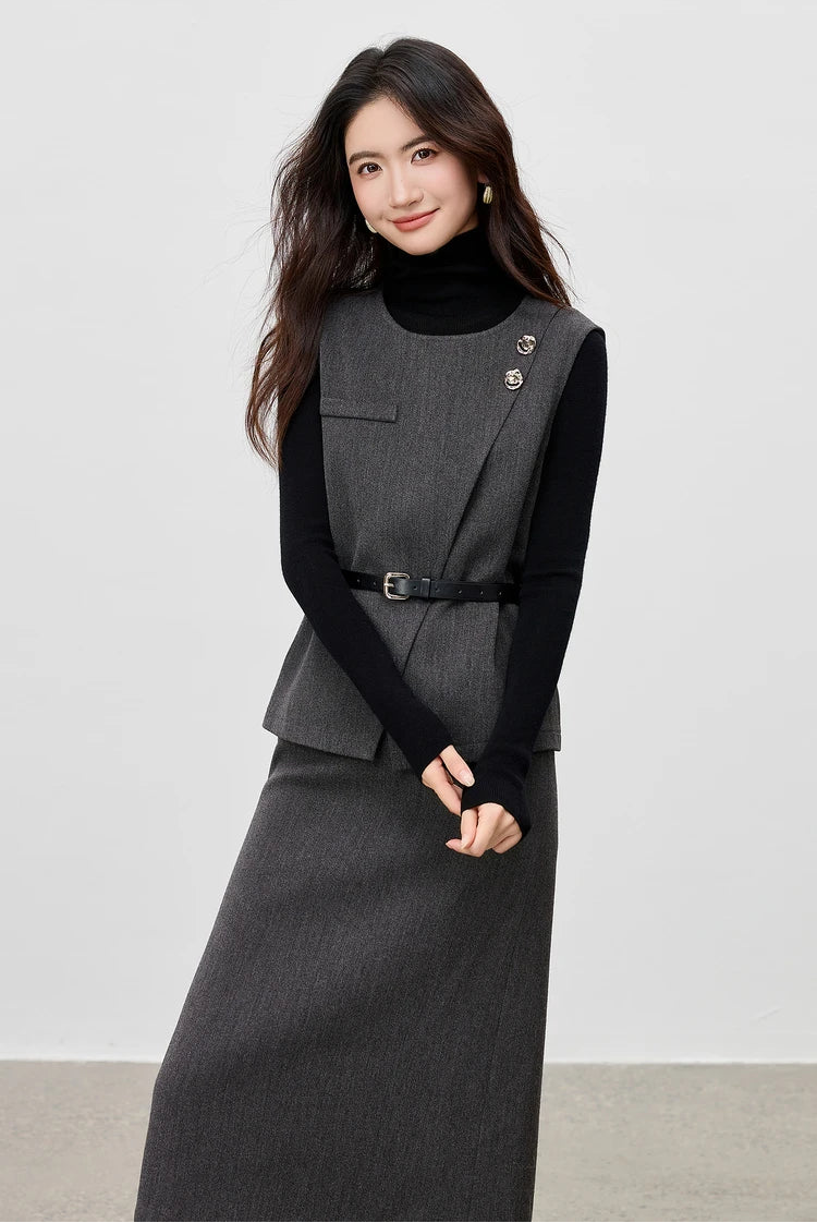 Model in a grey wool vest over a black turtleneck, detail of the sleeve and cuff styling — From Borcelleclothes.