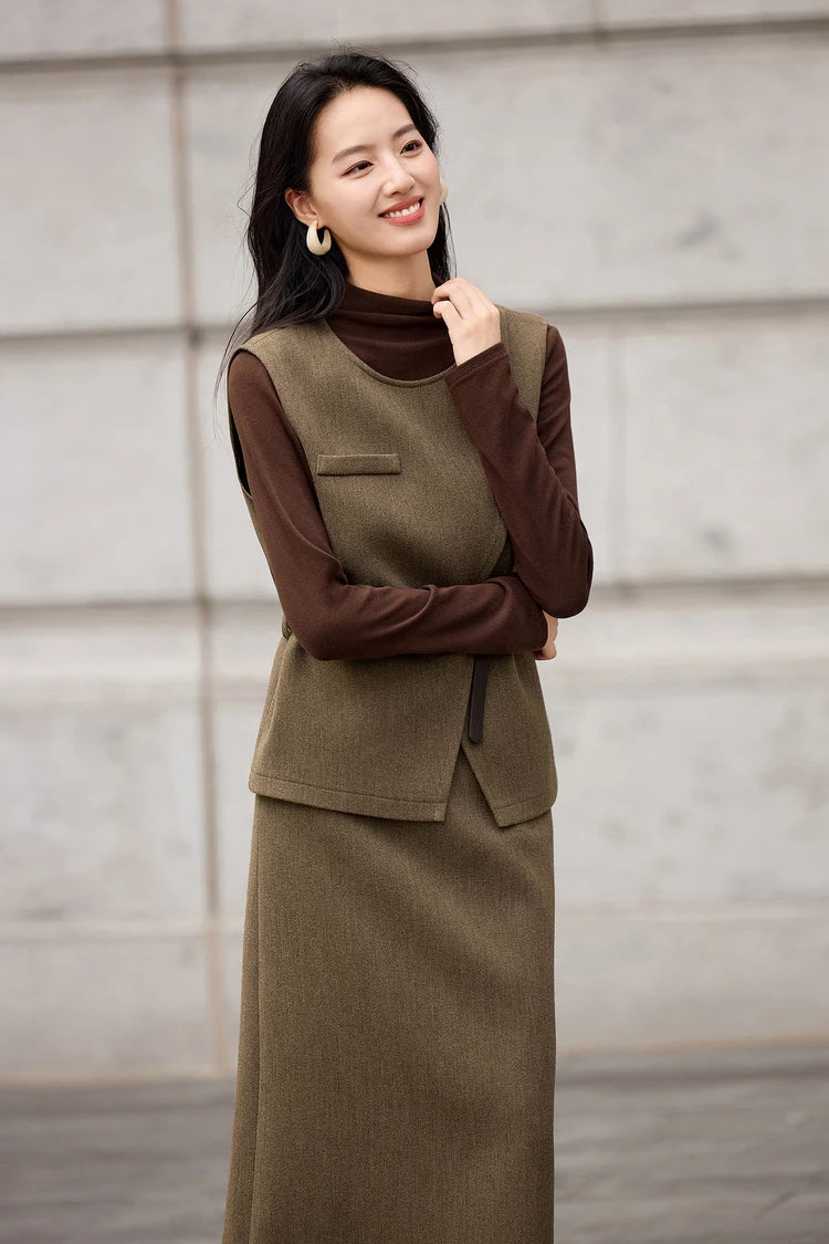 Model wearing an olive wool blend vest over a turtleneck, highlighting the structured neckline — From Borcelleclothes.