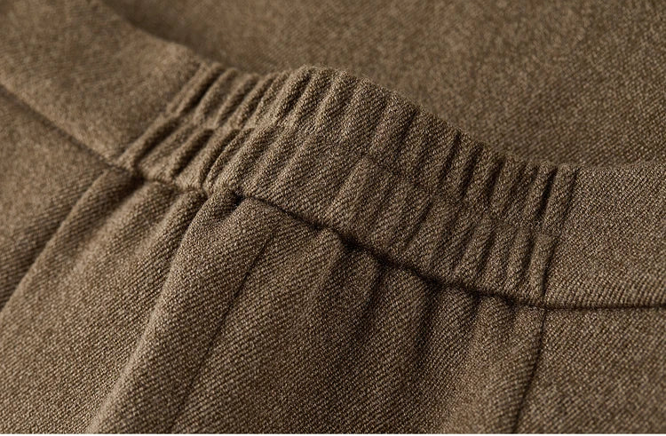 Technical detail of the partially elasticated waistband on the wool blend skirt for comfort fit — From Borcelleclothes.