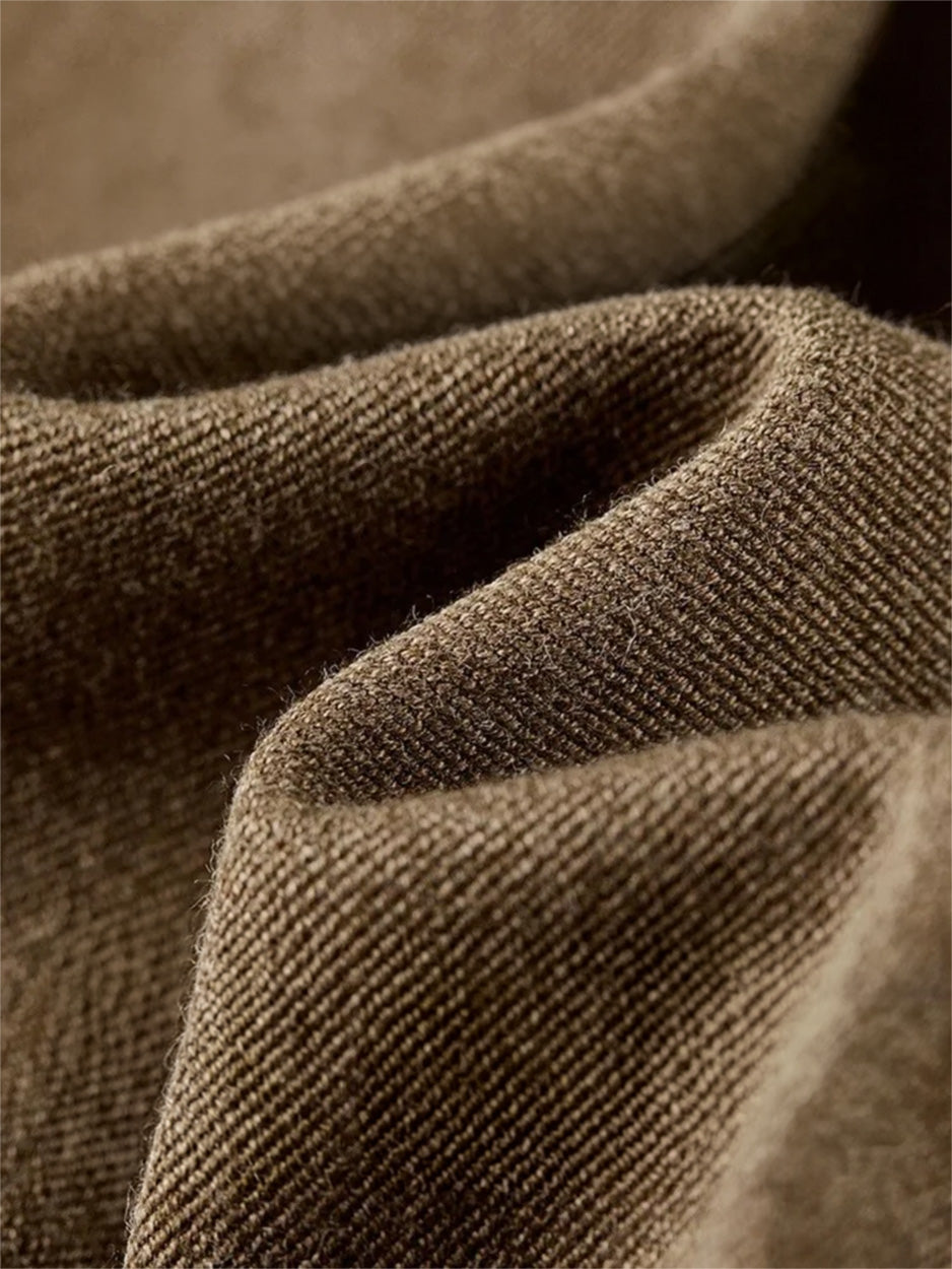 Close-up of the olive-brown wool blend twill texture, showing the heavy drape and fabric weave — From Borcelleclothes.