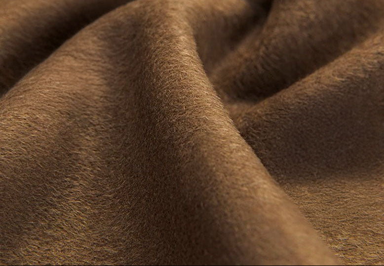 Close-up of the Gobi Haze grey wool texture. — From Borcelleclothes.