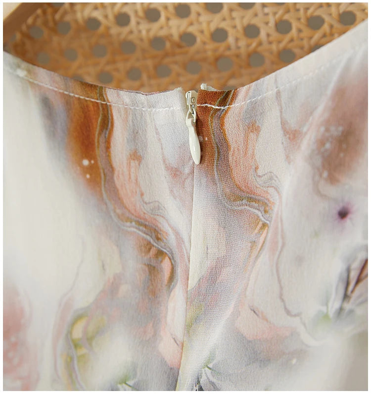 Close-up of the central back invisible zipper, seamlessly integrated into the premium crepe de chine silk — From Borcelleclothes.