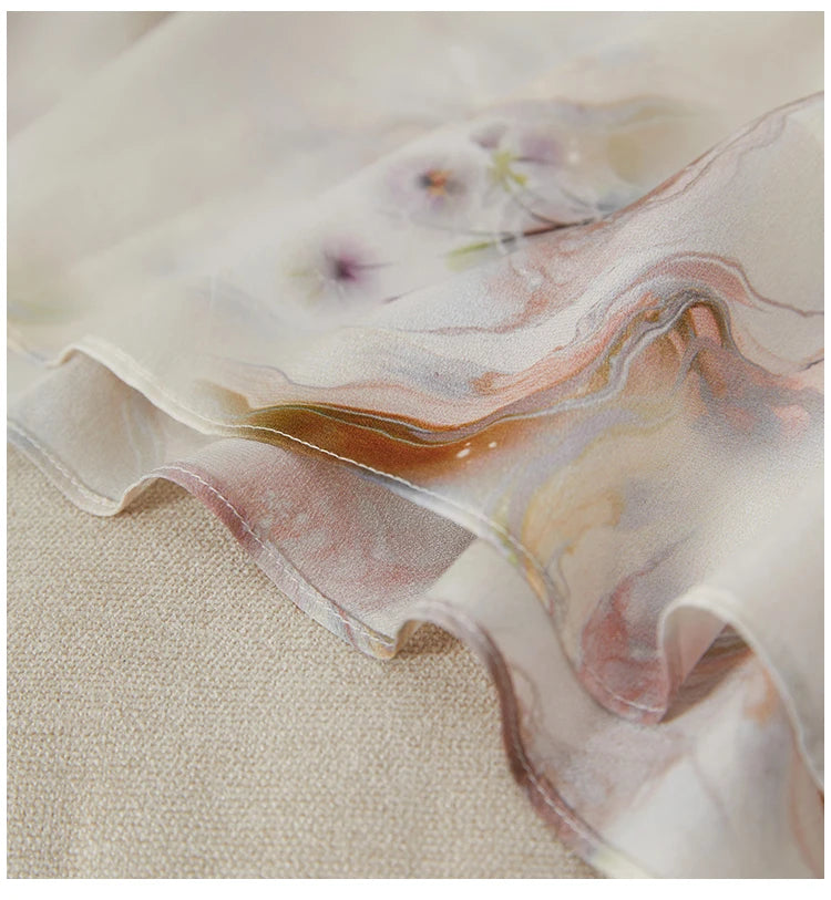 Detail of the clean, flowing bottom hem of the flared midi dress, showing how the lightweight silk catches the air — From Borcelleclothes.