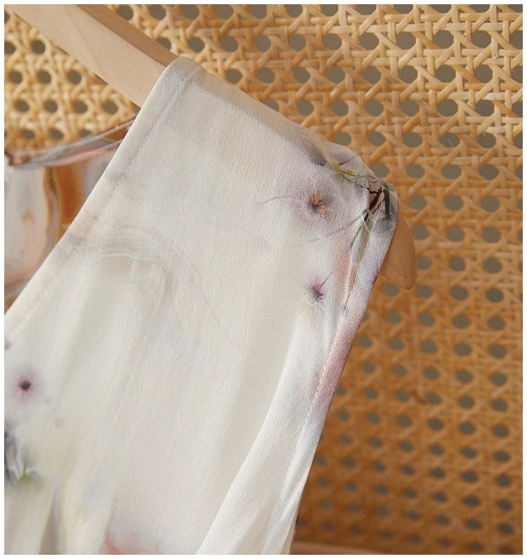 Close-up of the clean, sleeveless shoulder line of the silk wrap dress, showcasing the seamless stitching and premium fabric quality — From Borcelleclothes.