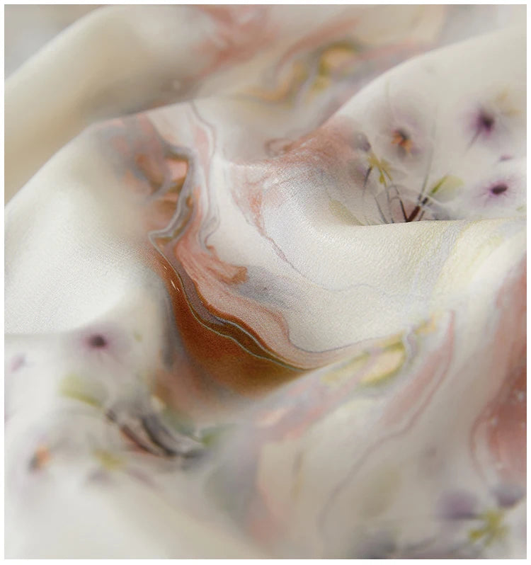 The gently pebbled texture of 100% Mulberry silk crepe de chine, folded in soft, wave-like drapes — From Borcelleclothes.