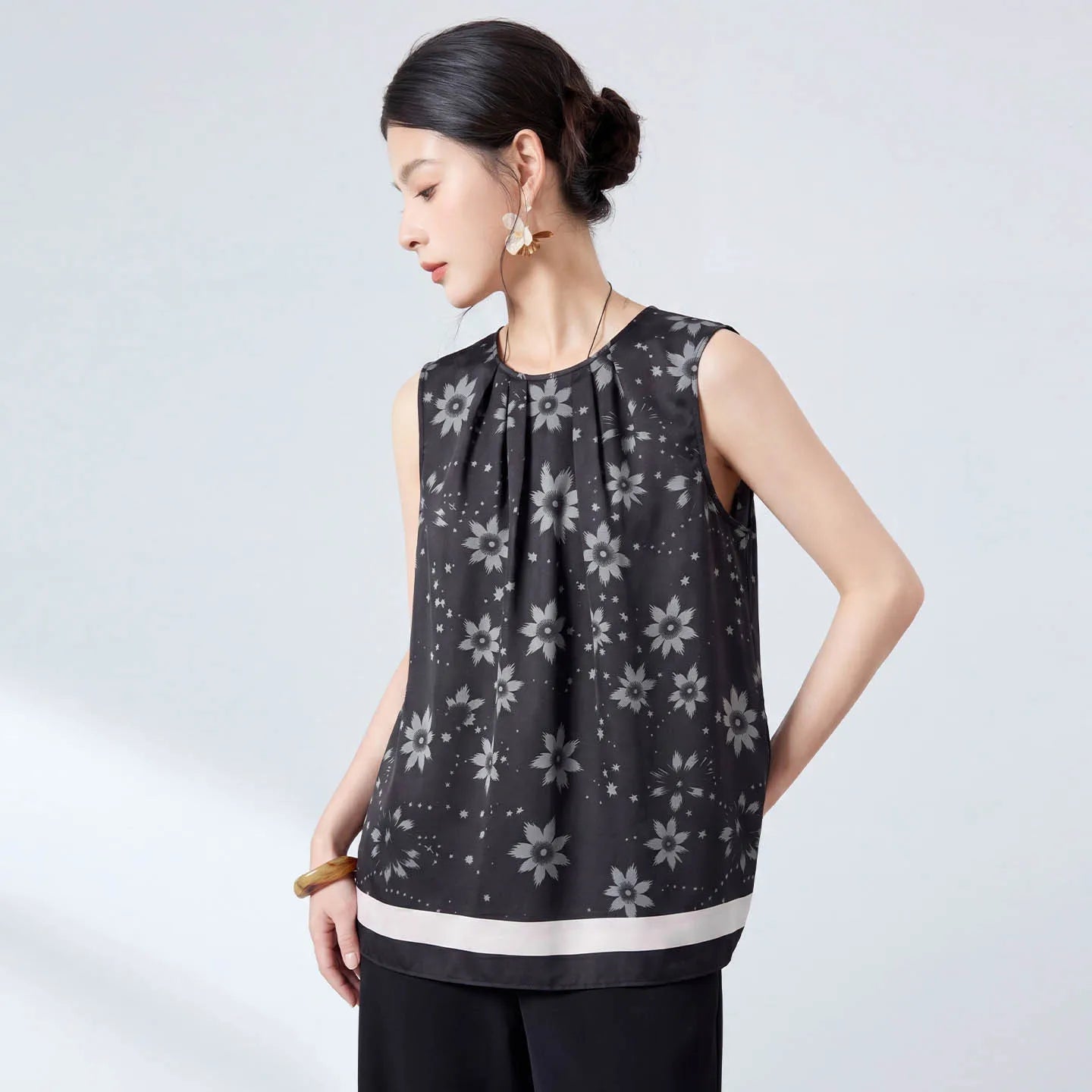 Women's 100% Mulberry silk twill (18 Momme) sleeveless blouse in Muted Sundrop with a border print. Features front and back pleats radiating from the neckline. — From Borcelleclothes.